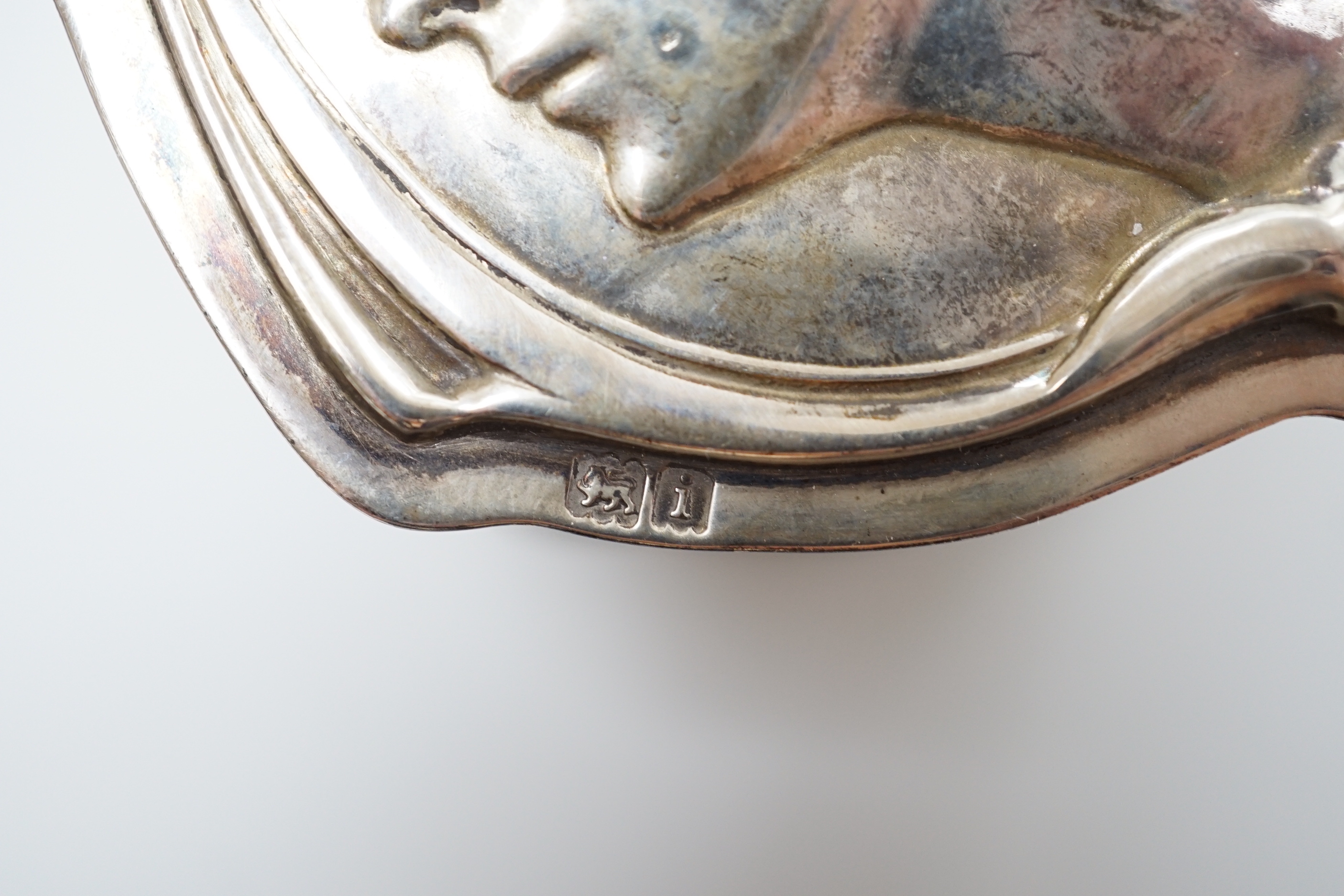 An Edwardian silver mounted circular easel mirror, Walker & Hall, 26.5cm, an Art Nouveau silver trinket box, William Hutton & Sons, London , 1904 and a silver milk jug.